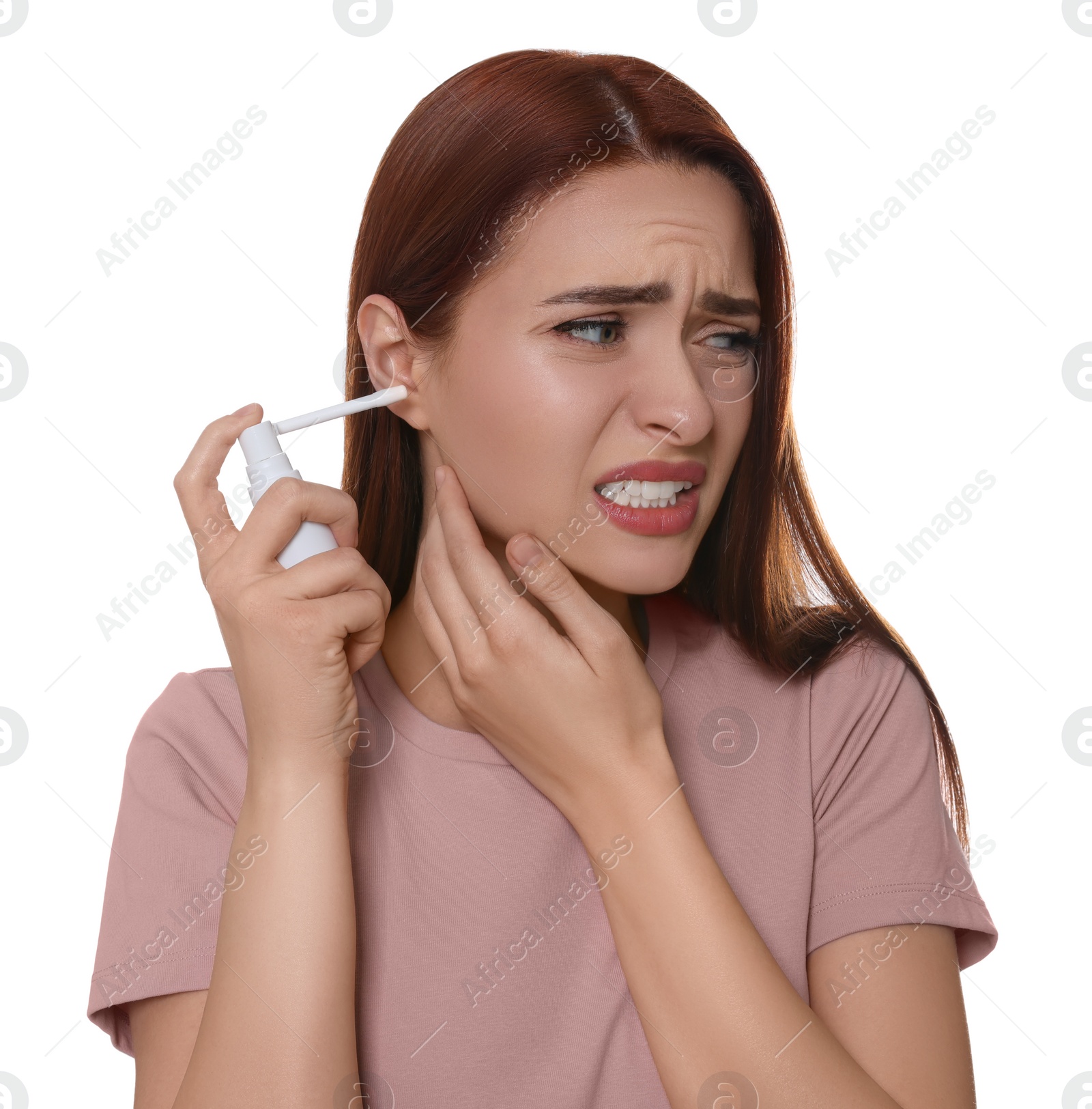 Photo of Unhappy woman using ear spray on white background