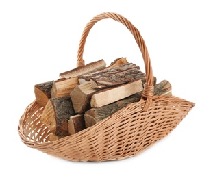 Wicker basket with firewood on white background