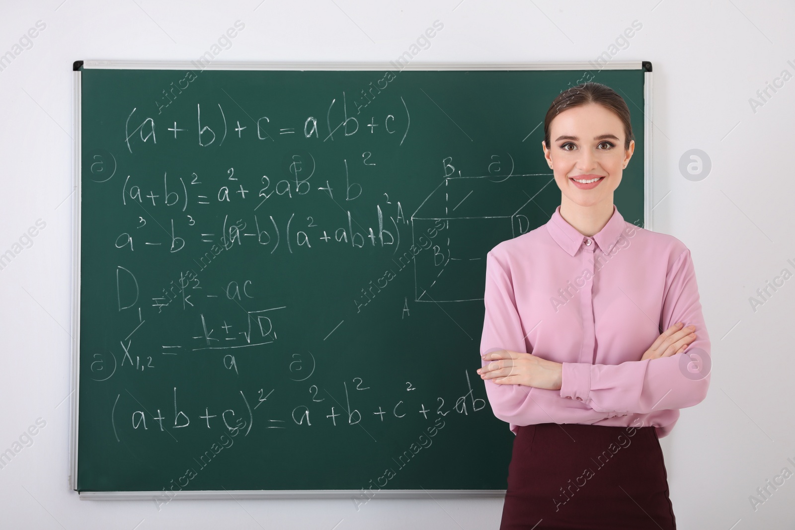 Photo of Portrait of young female teacher in classroom