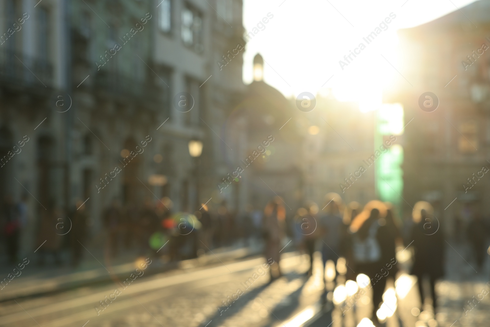 Photo of Blurred view of people walking on city street