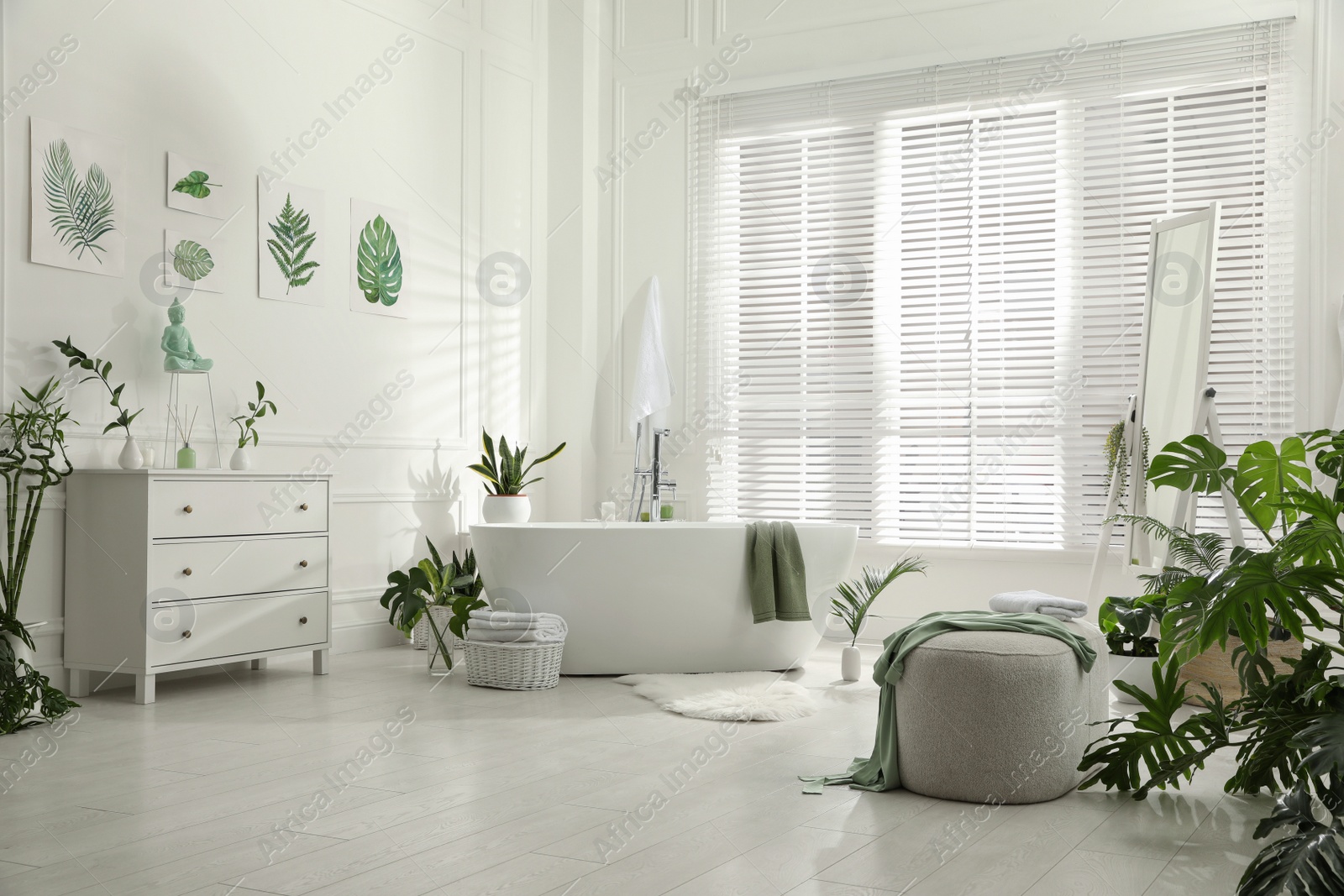 Photo of Stylish bathroom interior with green plants. Home design