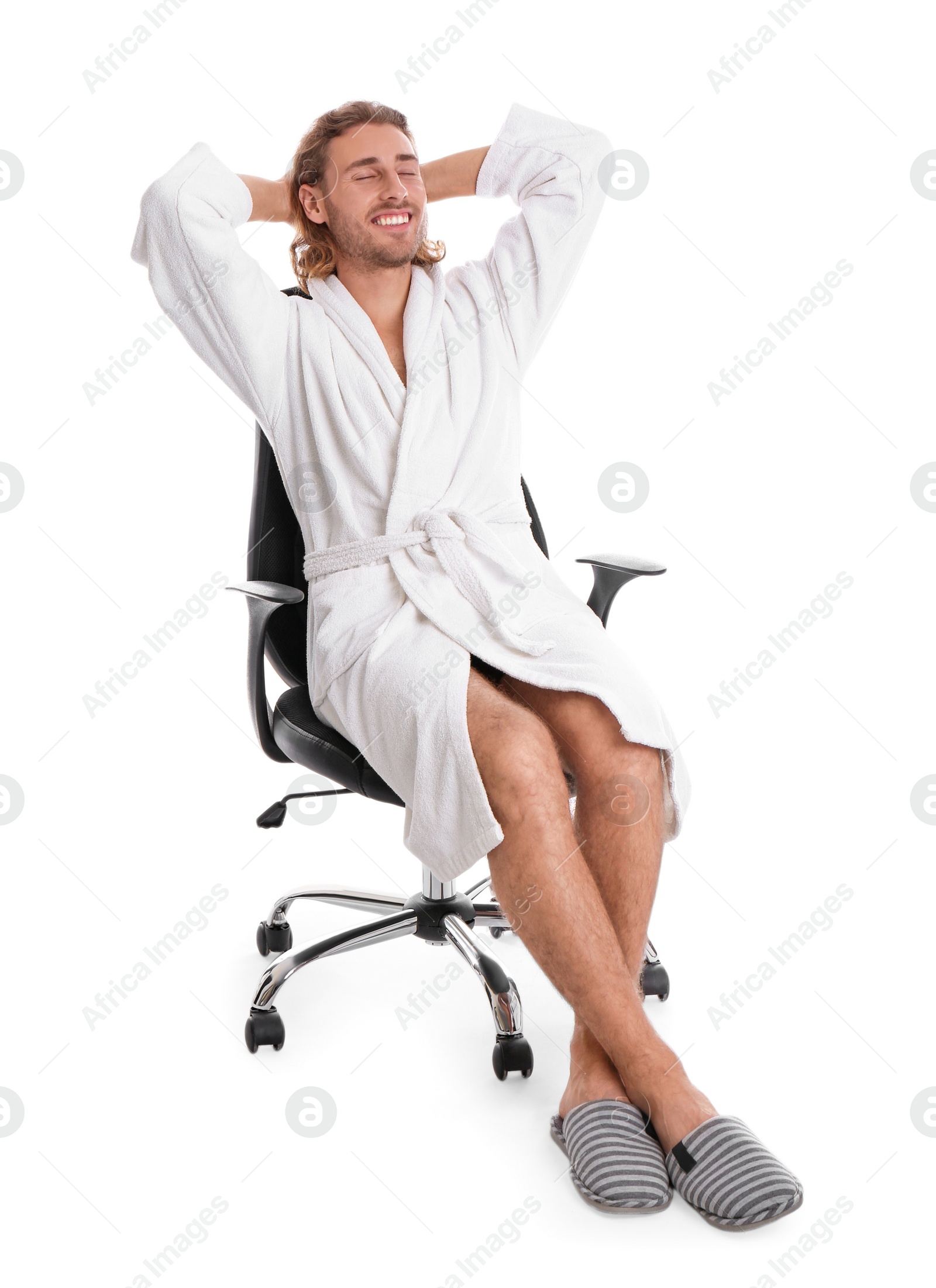 Photo of Young man in bathrobe on white background