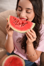 Photo of Beautiful young woman with watermelon on chair