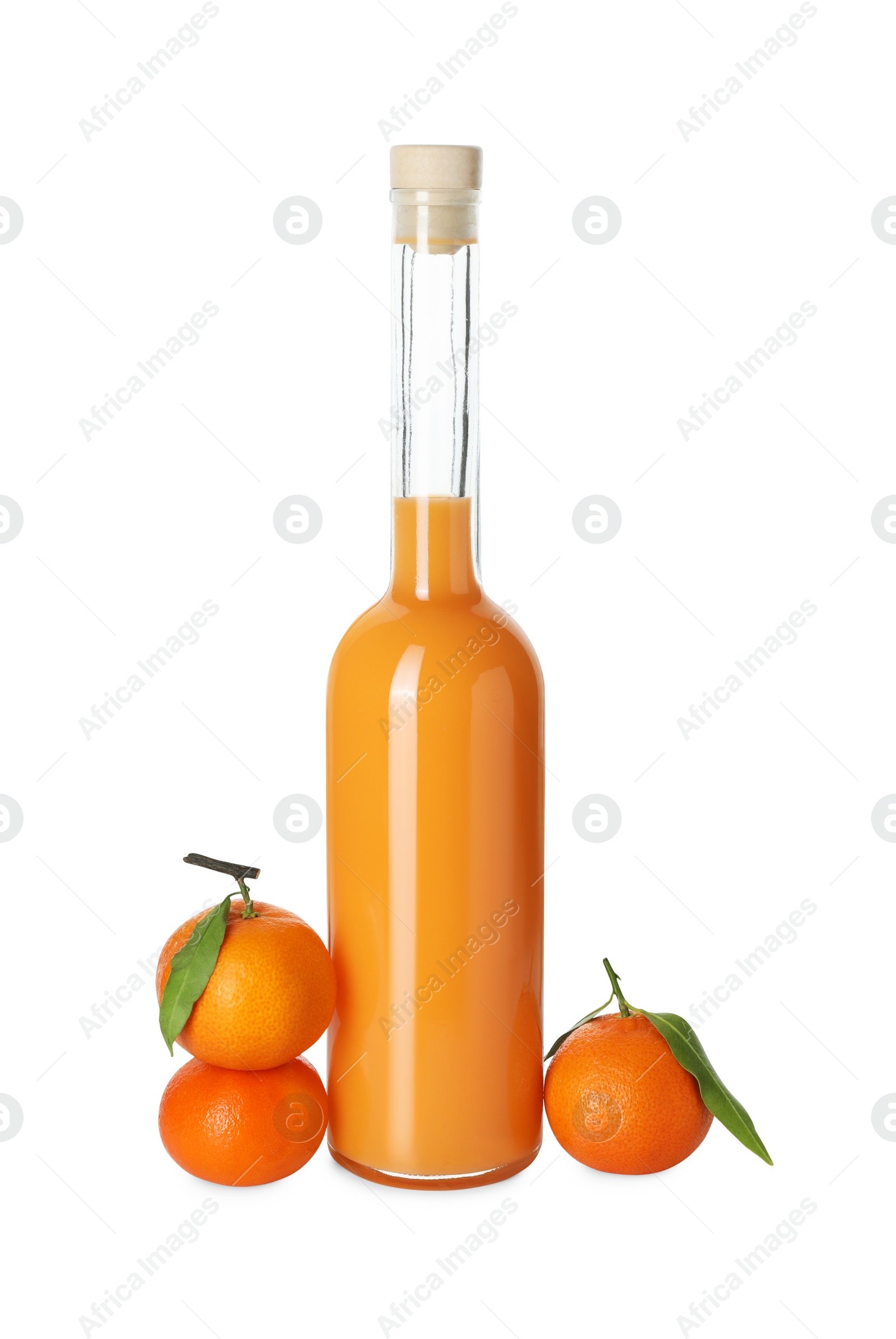 Photo of Bottle of tasty tangerine liqueur and fresh fruits isolated on white