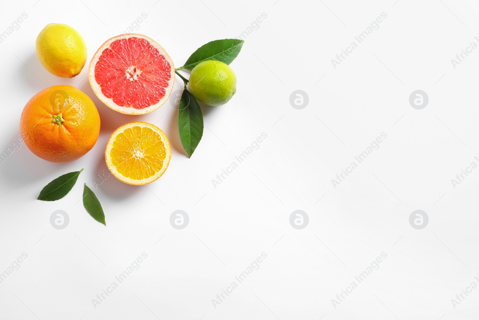 Photo of Flat lay composition with different citrus fruits on white background