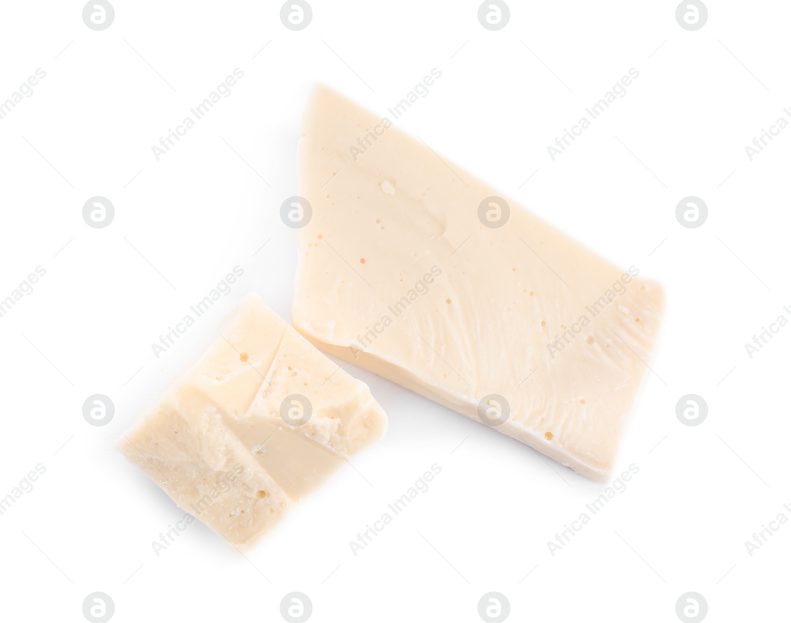 Photo of Pieces of tasty chocolate isolated on white, top view