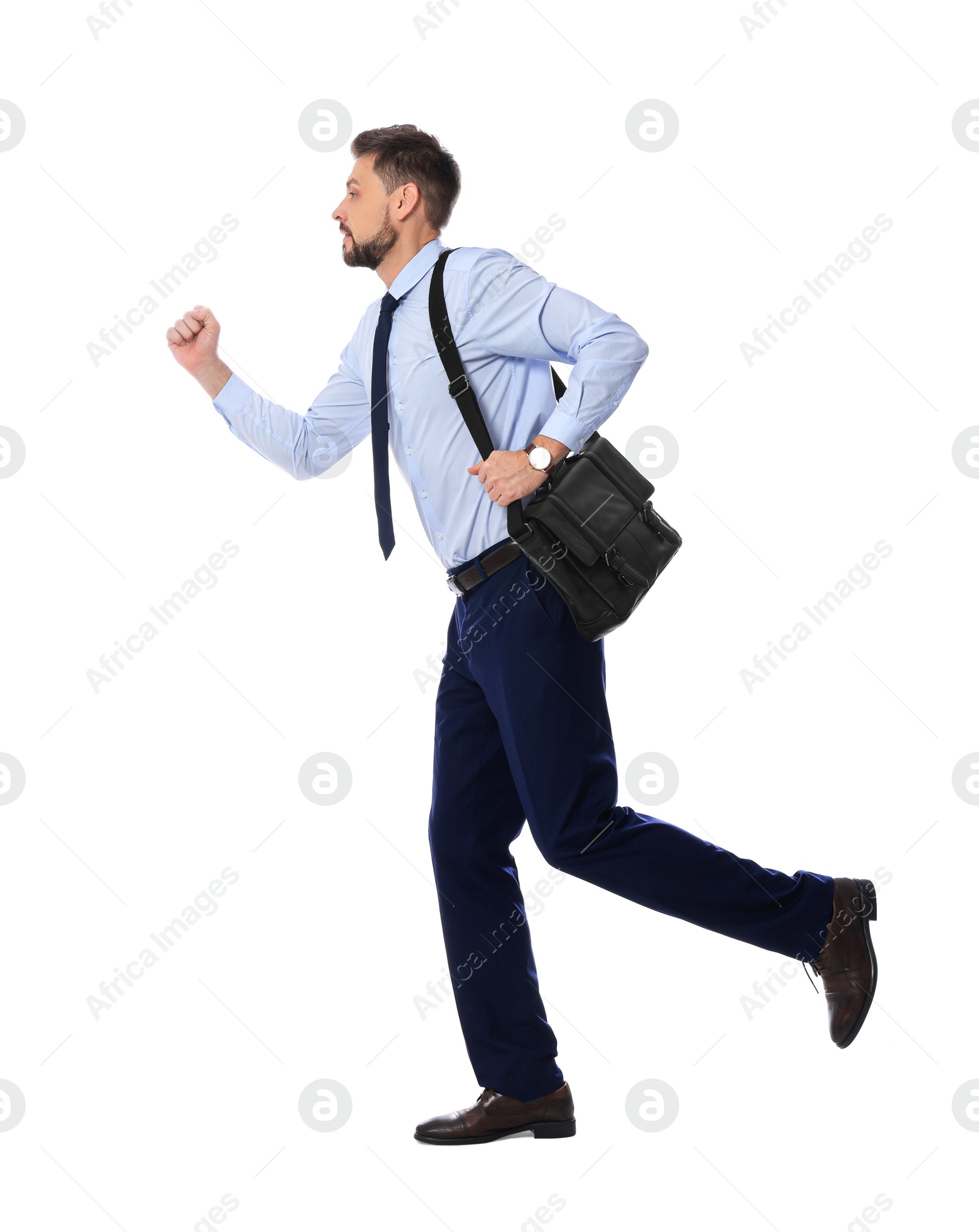 Photo of Handsome bearded businessman running on white background