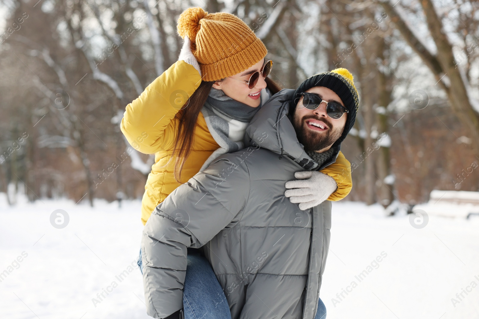 Photo of Happy young couple having fun outdoors on winter day