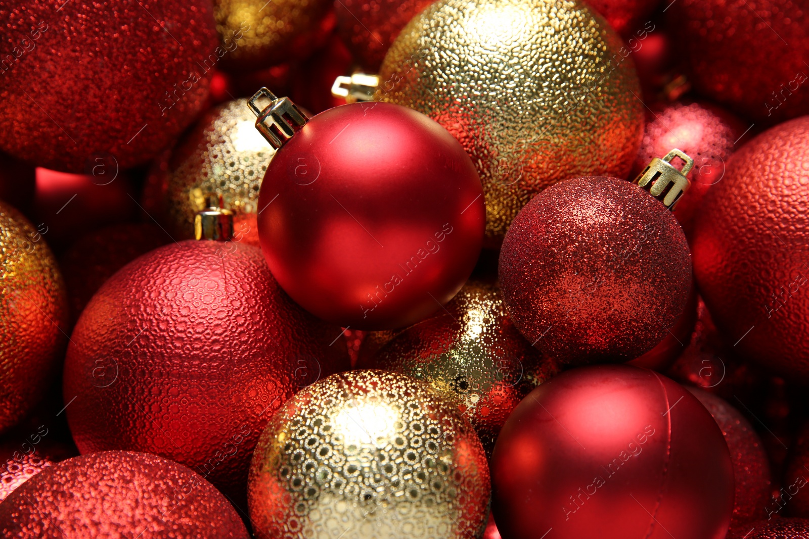 Photo of Red and golden Christmas balls as background, closeup