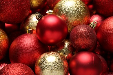 Red and golden Christmas balls as background, closeup