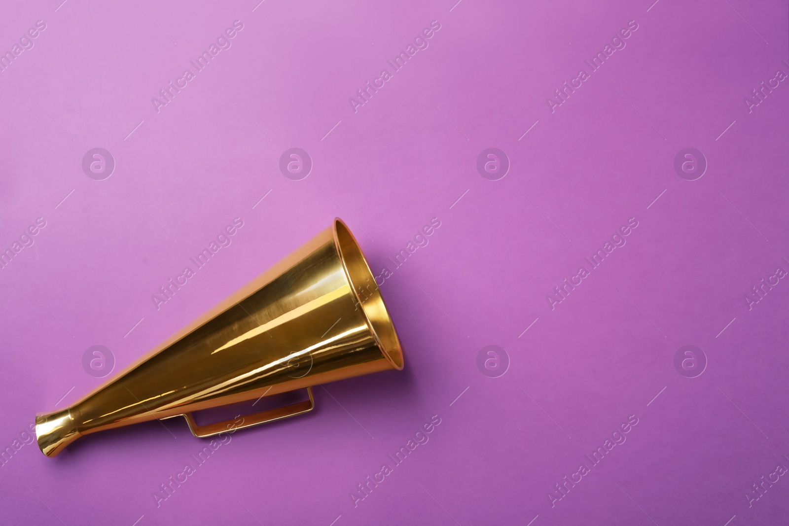 Photo of Retro megaphone on color background