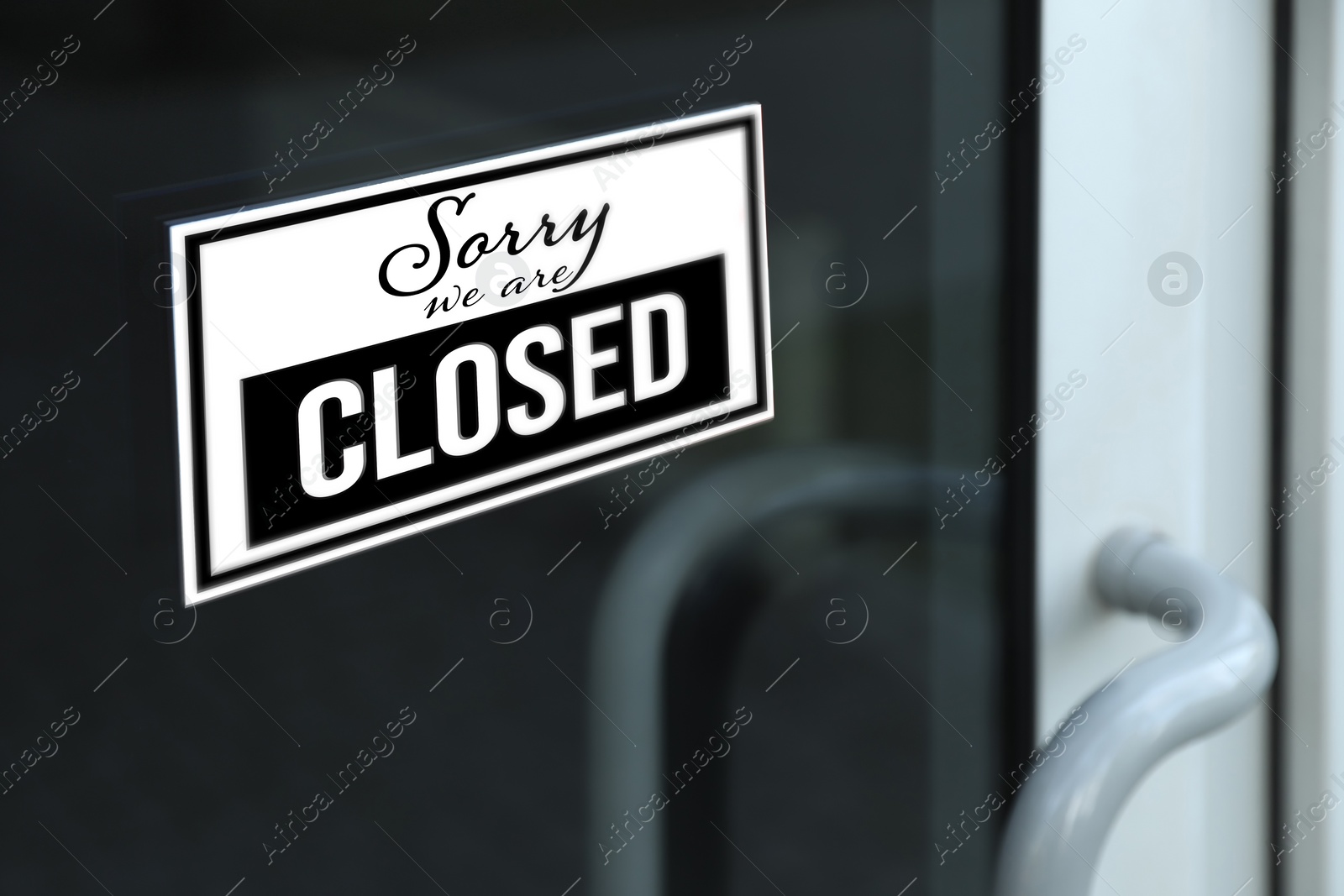 Image of Sorry we are closed sign on glass door