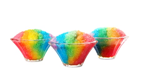 Photo of Rainbow shaving ice in glass dessert bowls isolated on white