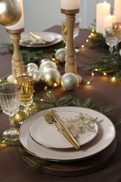 Table setting with festive lights and Christmas decor