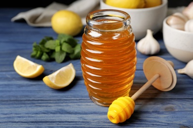 Photo of Composition with natural cough remedies on wooden table