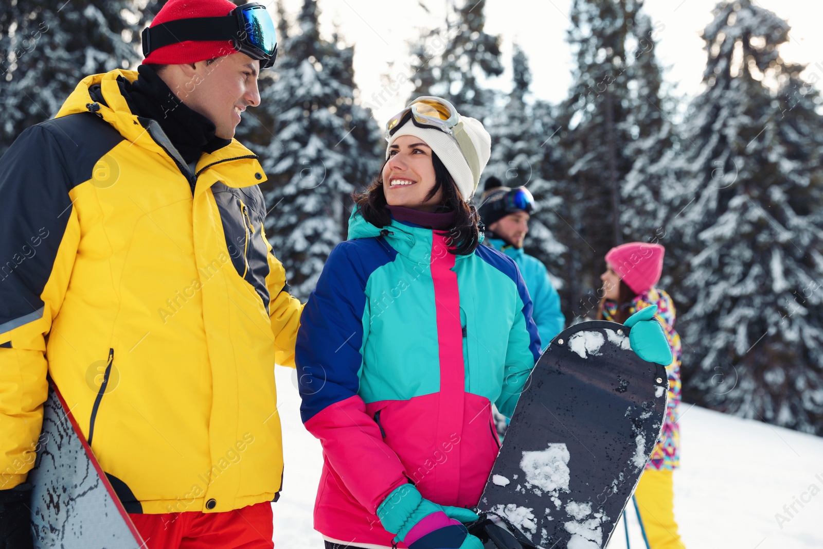 Photo of Happy couple with equipment at ski resort. Winter vacation