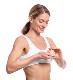 Woman with jar of body cream on white background