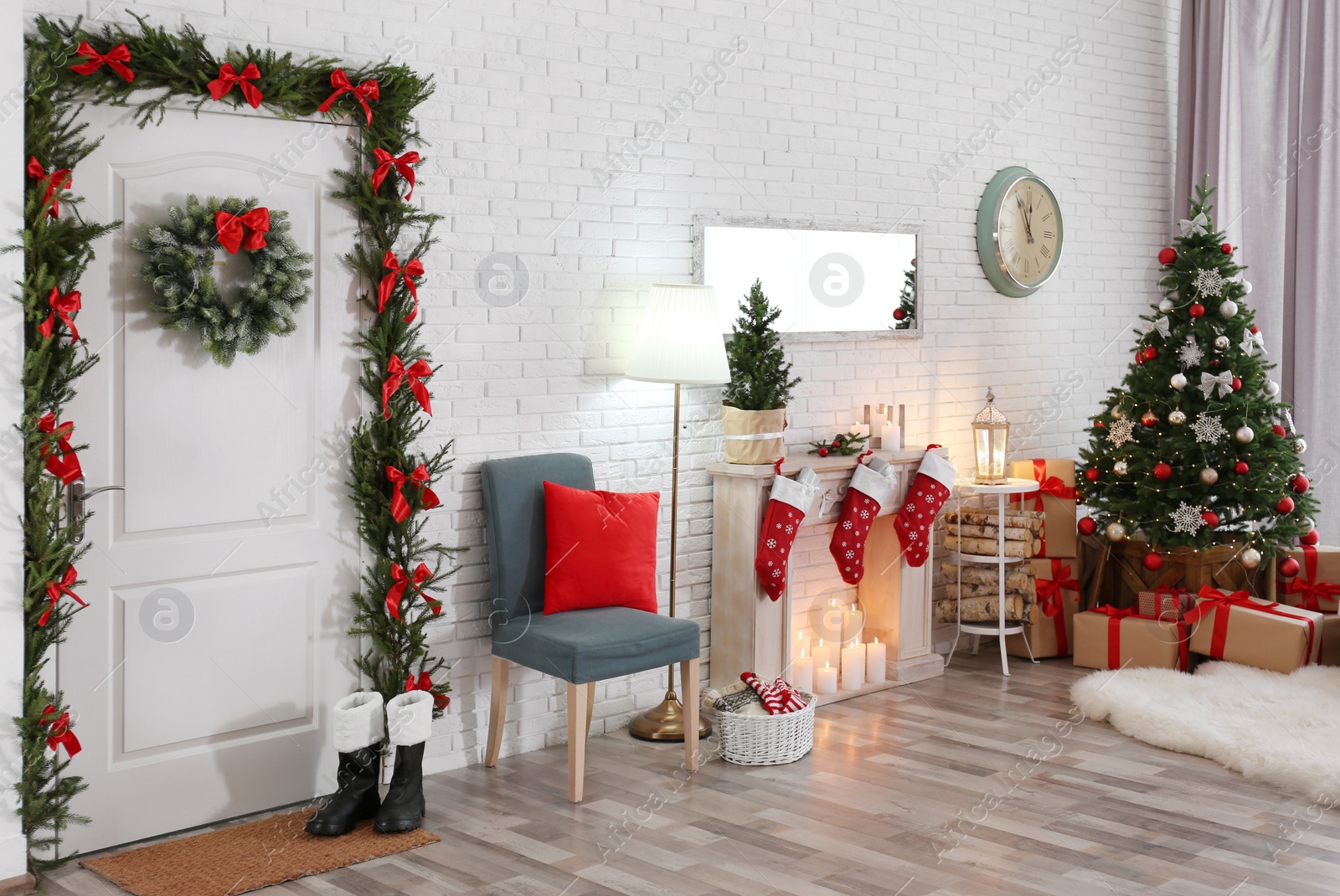 Photo of Stylish interior with beautiful Christmas tree and decorative fireplace