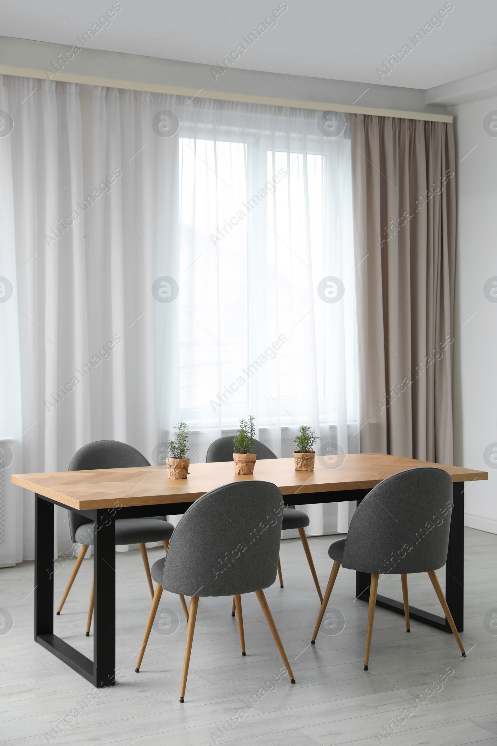 Photo of Modern room interior with chairs and table