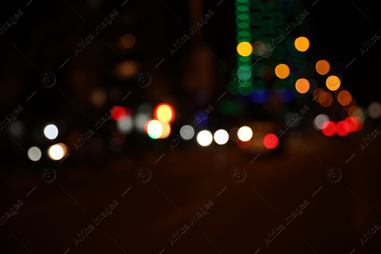 Photo of Blurred view of cityscape with bokeh effect. Night life