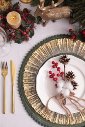 Photo of Luxury festive place setting with beautiful decor for Christmas dinner on white table, flat lay