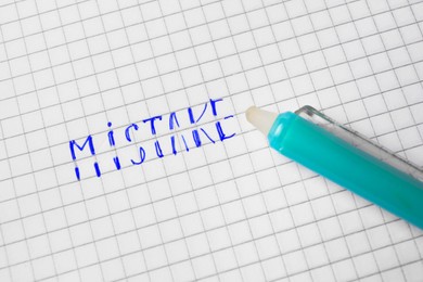 Word Mistake written on checkered paper with erasable pen, top view
