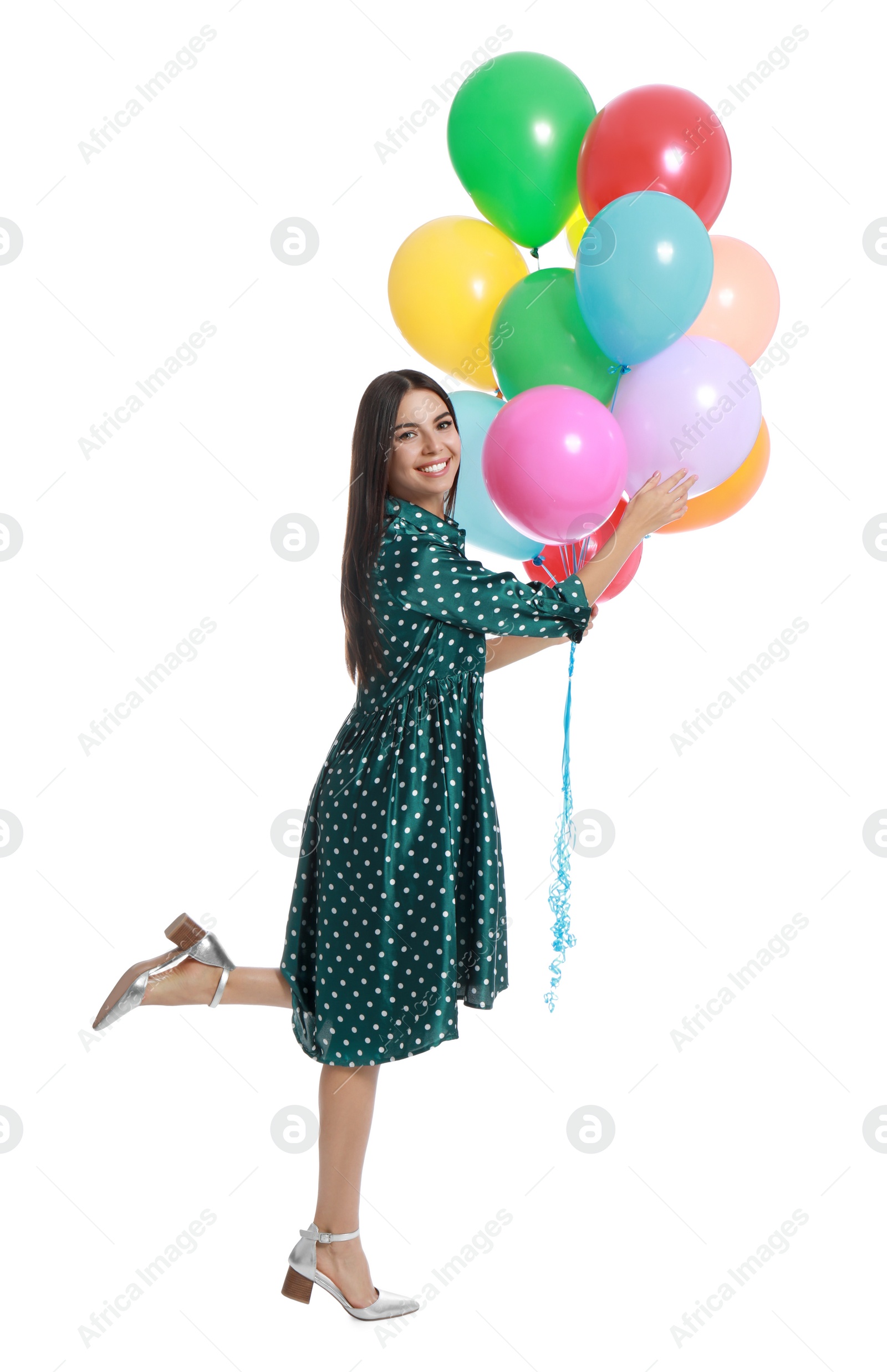 Photo of Young woman holding bunch of colorful balloons on white background