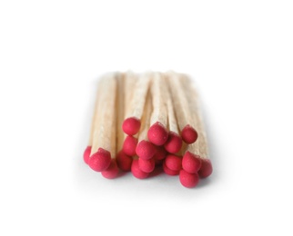 Photo of Pile of wooden matches on white background