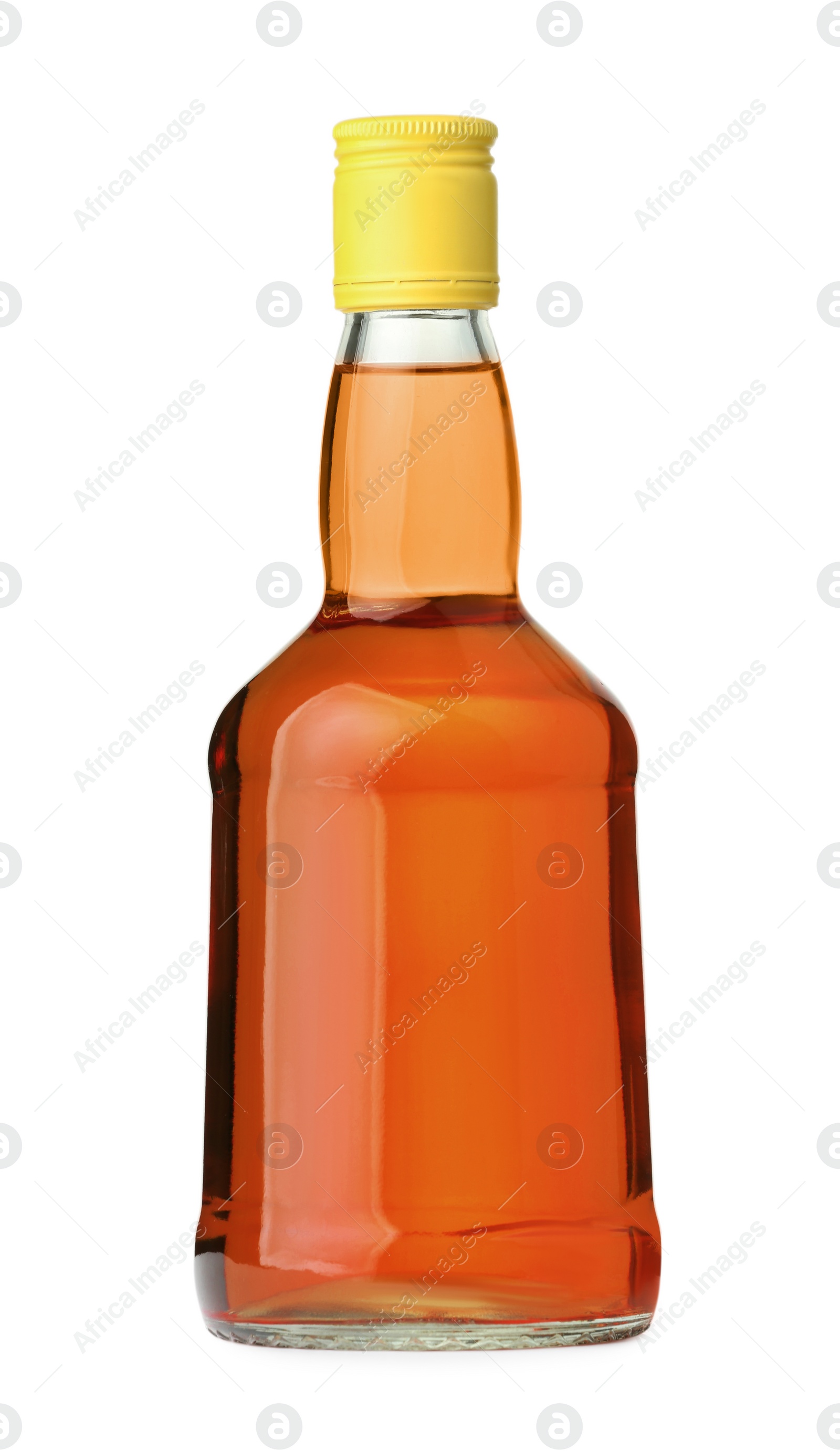 Photo of Whiskey in glass bottle isolated on white