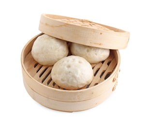 Delicious chinese steamed buns in bamboo steamer isolated on white