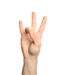 Photo of Man showing number seven on white background, closeup. Sign language