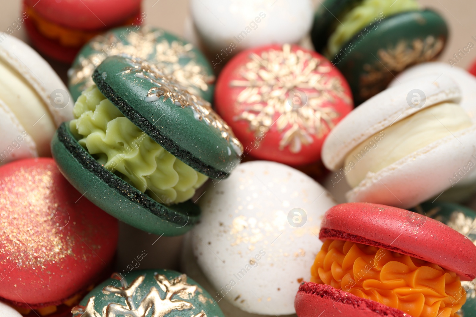 Photo of Beautifully decorated Christmas macarons as background, closeup