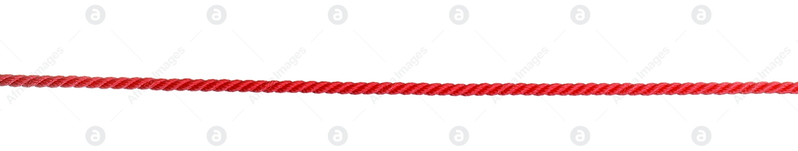 Photo of Strong red climbing rope on white background