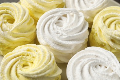 Photo of Many white and yellow delicious zephyrs, closeup