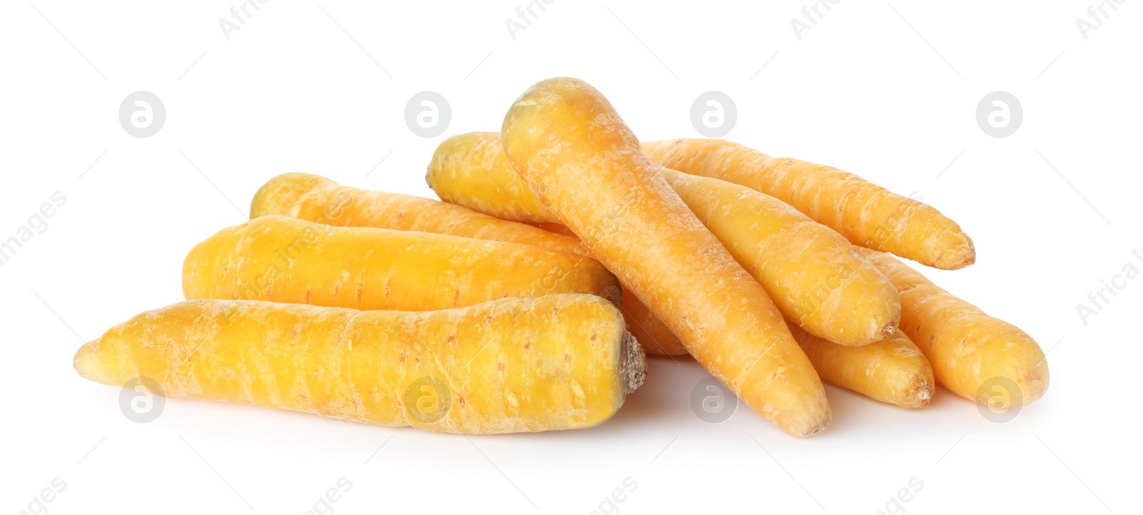 Photo of Fresh raw yellow carrots isolated on white