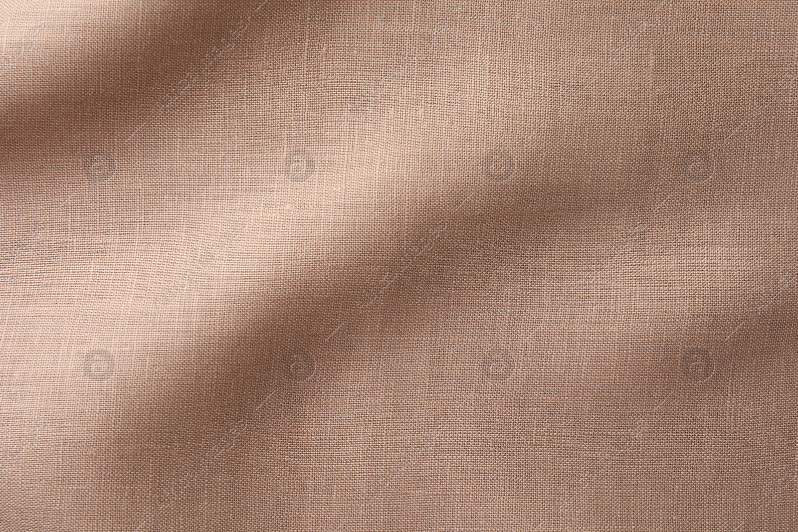 Photo of Texture of brown crumpled fabric as background, top view