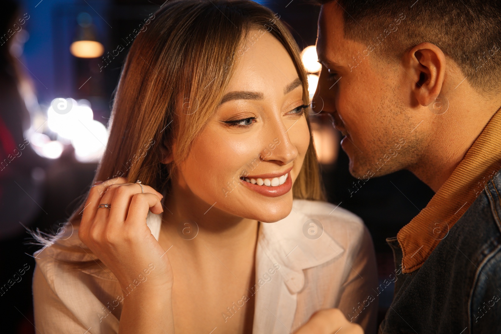 Photo of Man and woman flirting with each other in bar