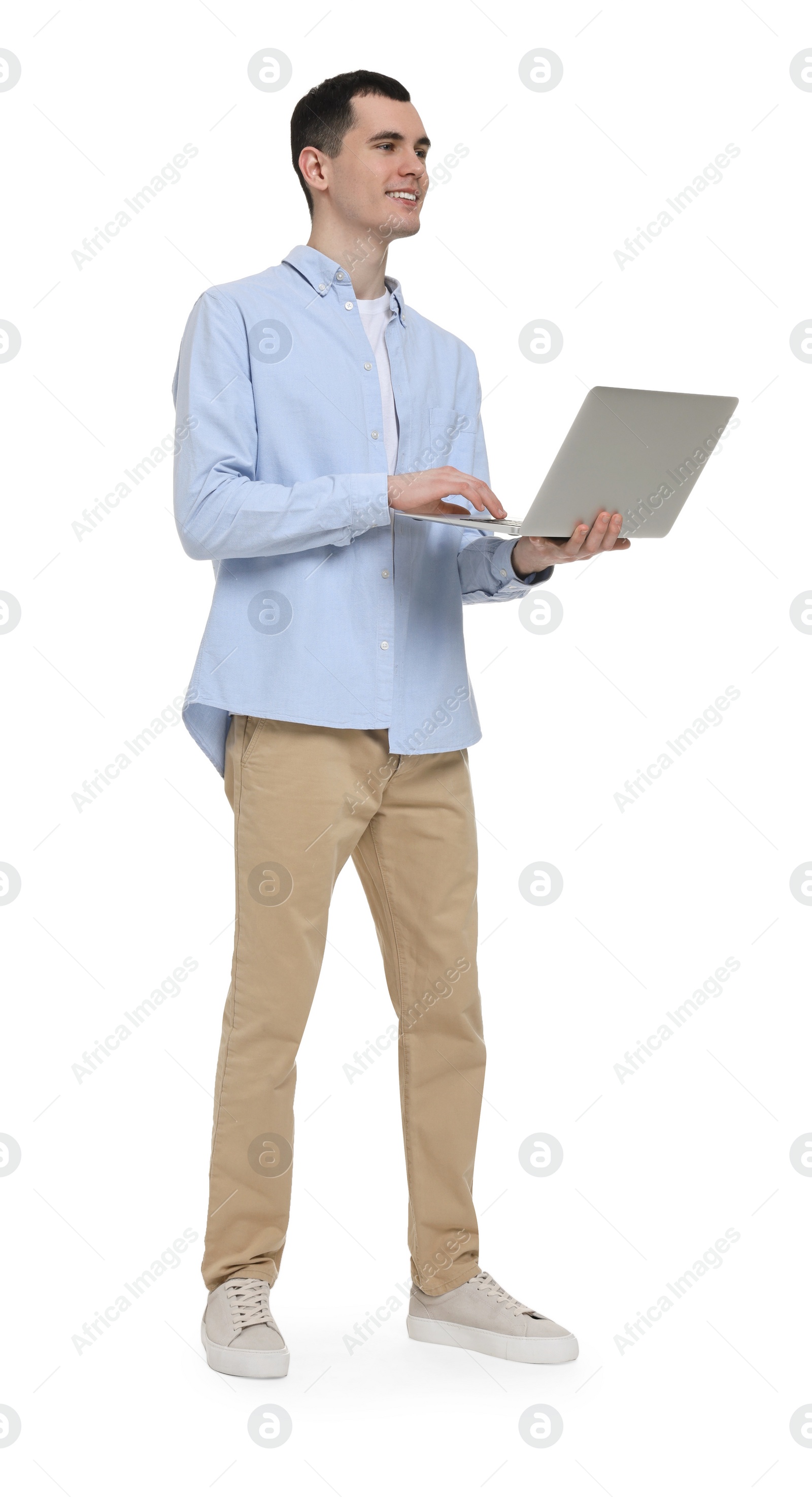 Photo of Young man using laptop on white background