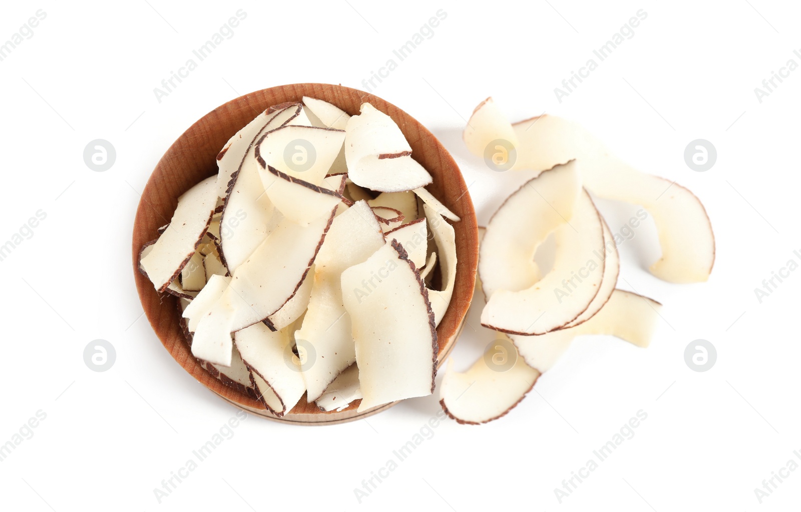 Photo of Tasty coconut chips in wooden bowl isolated on white, above view