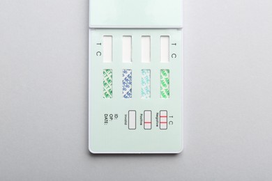 Photo of Multi-drug screen test on light grey background, top view