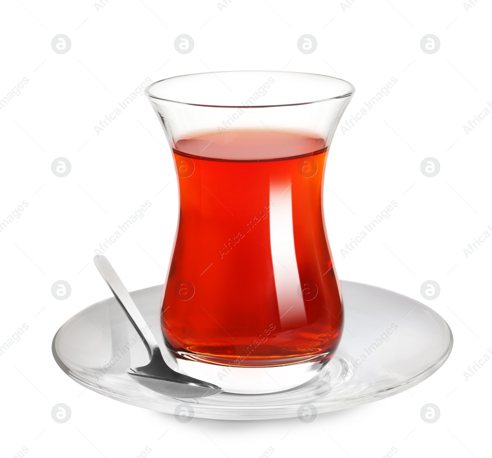 Photo of Glass of traditional Turkish tea with spoon isolated on white