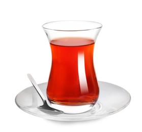 Glass of traditional Turkish tea with spoon isolated on white
