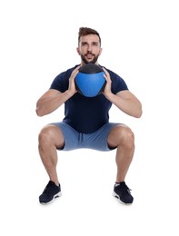 Photo of Athletic man doing squats with medicine ball isolated on white
