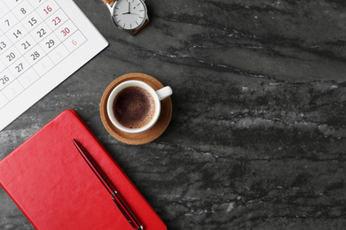 Flat lay composition with calendar on grey marble table, space for text