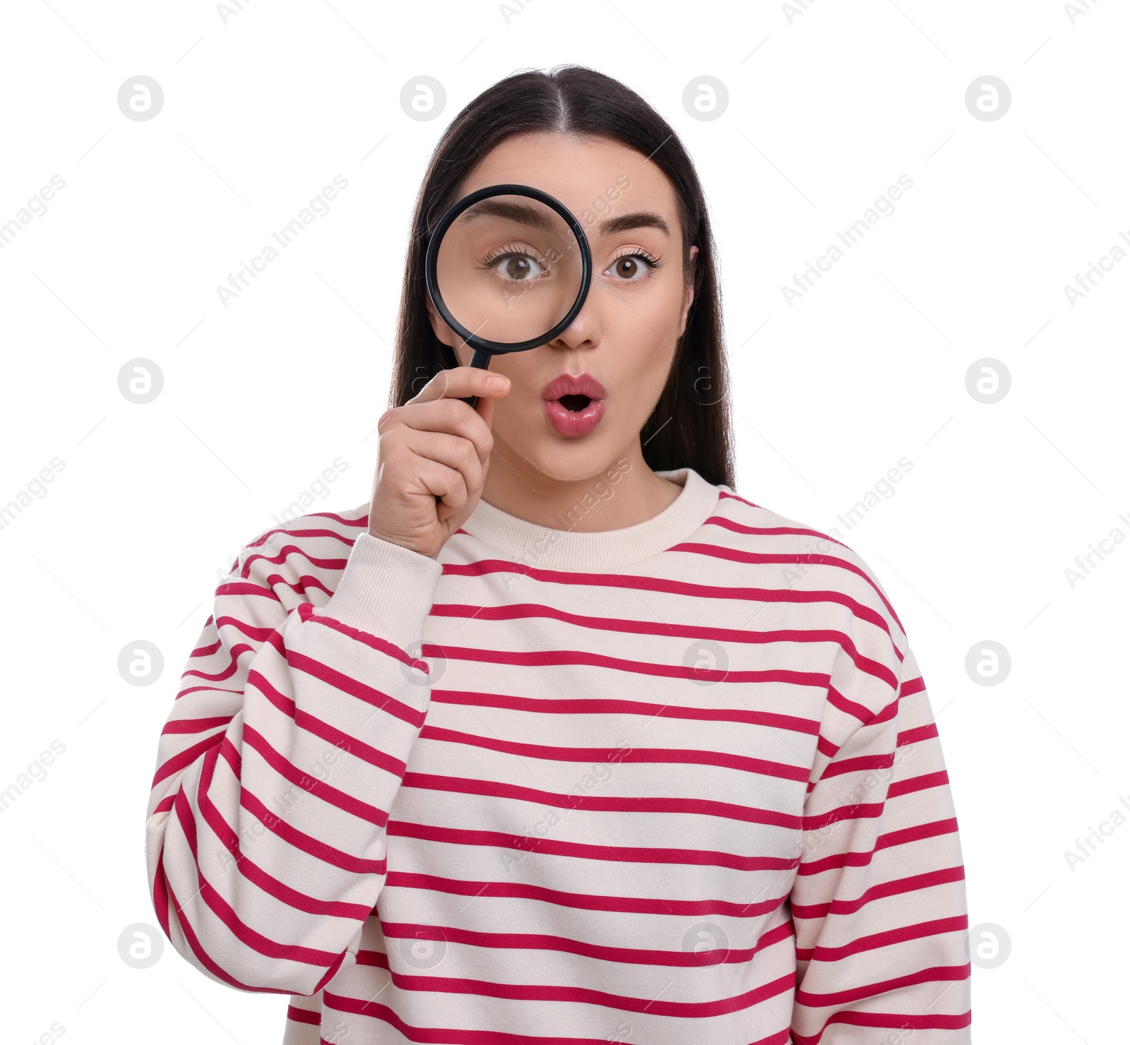 Photo of Curious young woman looking through magnifier glass on white background