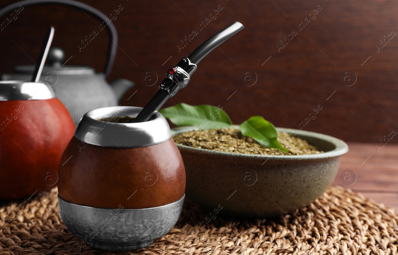 Photo of Calabashes with mate tea and bombilla on table