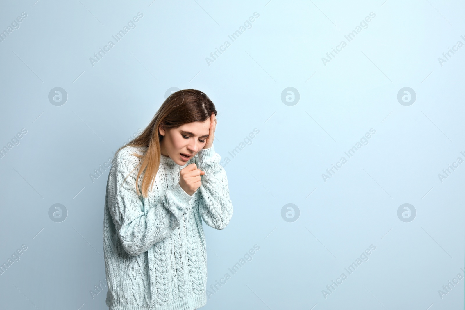 Photo of Woman coughing on color background