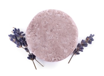 Photo of Solid shampoo bar and lavender flowers on white background, top view. Hair care