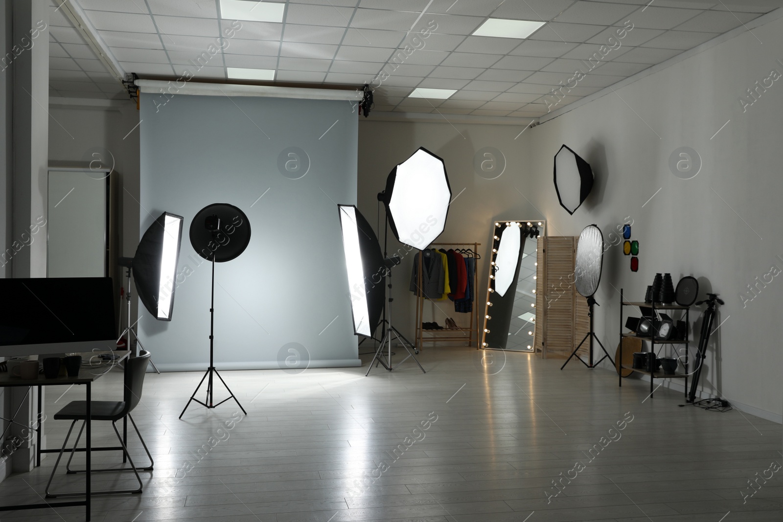 Photo of Interior of modern photo studio with professional equipment