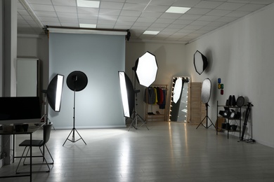 Interior of modern photo studio with professional equipment